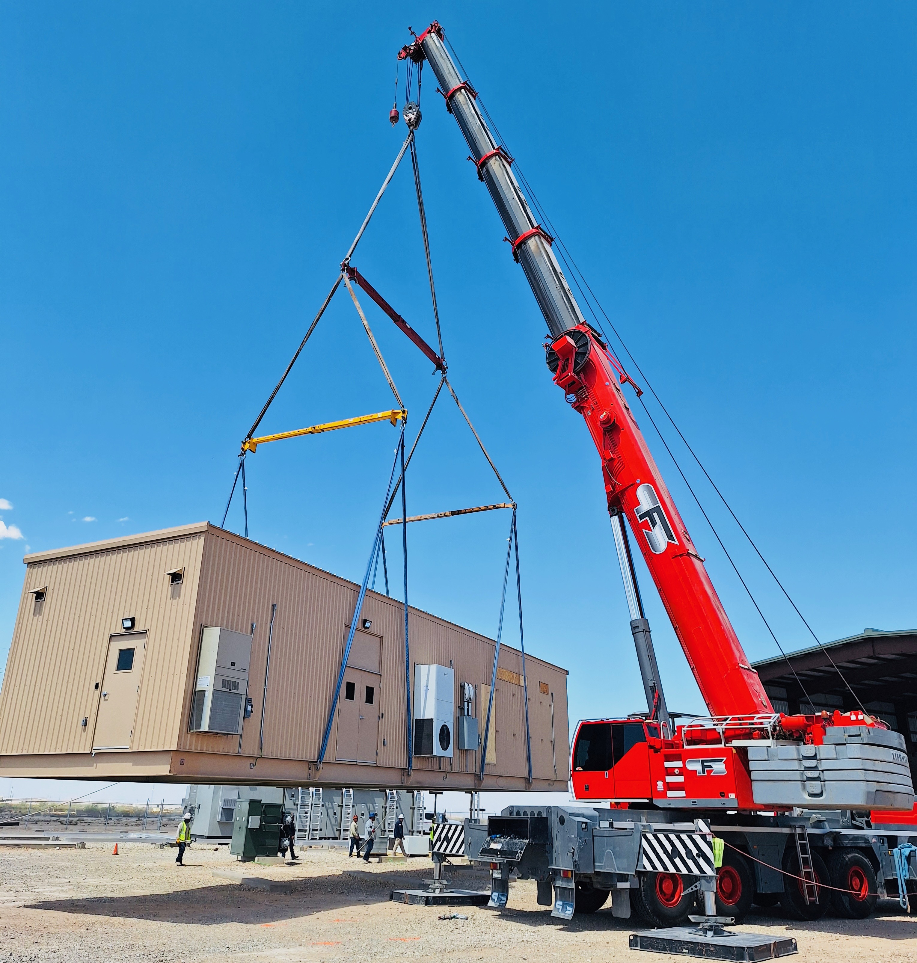 Modular building being lifted by crane